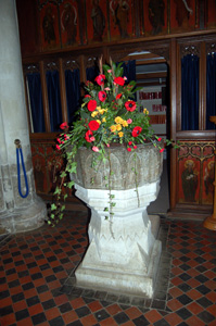 Clifton font, showing the 15th century screen behind November 2009